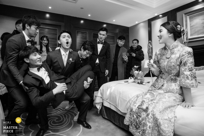 Photo by: <a href="https://www.wpja.com/contests/2018-v19/best-wedding-photographers/2380156">Di Liu - Hangzhou </a> Hangzhou City wedding photojournalism image of a couple before the ceremony at home