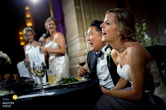 Civic Opera House image of the bride and groom laughing during reception speeches Civic Opera House | bride and groom laughing during reception speeches
