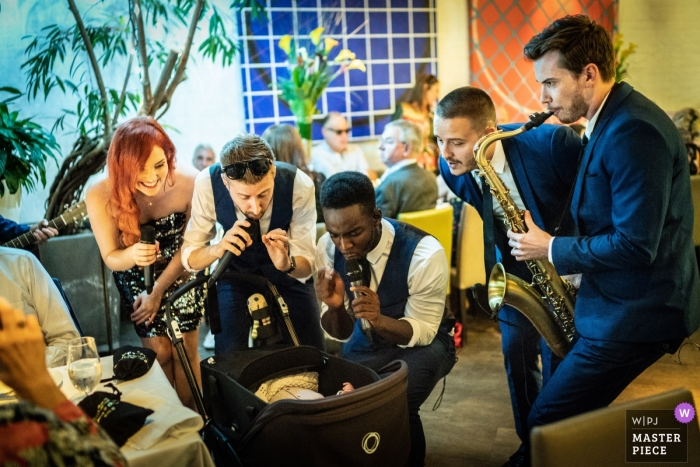Photo by: <a href="https://www.wpja.com/contests/2018-v20/best-wedding-photographers/2399031">Harry Richards - Islington London</a> London Wedding Photography | Musicians Play for a Baby at a Quiet Wedding