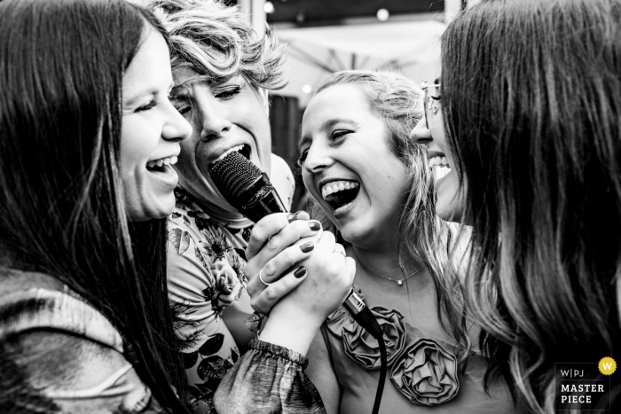 Spain Valencia wedding reception image of 4 women singing