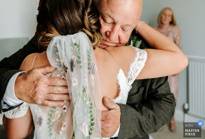 Wedding photography of dad hugging bride in England Wedding photography of dad hugging bride | England and Shropshire wedding photography