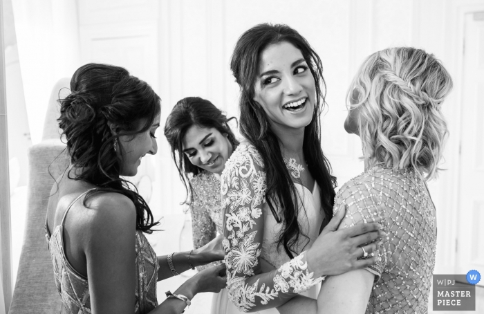 Photo by: <a href="https://www.wpja.com/contests/2018-v20/best-wedding-photographers/2408046">Kerry Morgan - Beziers </a> Hedsor House Bucks UK Wedding Getting Ready - Doing up the dress