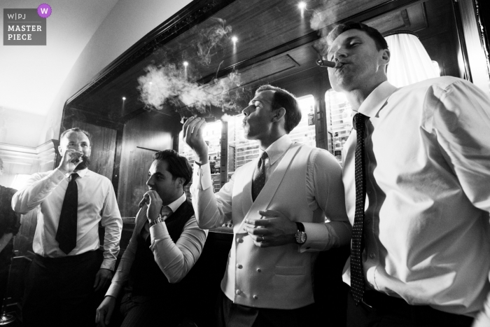 Photo by: <a href="https://www.wpja.com/contests/2018-v20/best-wedding-photographers/2408736">Francesco Survara - Rome Roma</a> Wedding photo of the groom and best friends with cigars at the Villa Cora