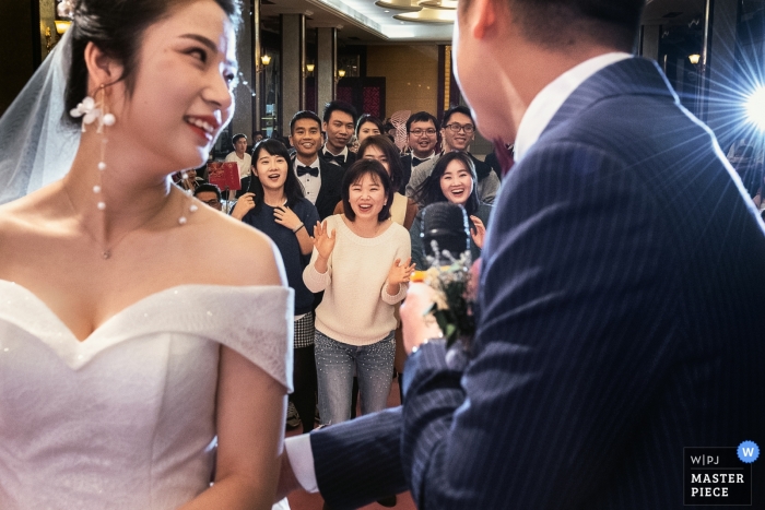 Photo by: <a href="https://www.wpja.com/contests/2019-v01/best-wedding-photographers/2427831">Jinqi Tan - Guangzhou </a> Guangzhou China wedding reception - Scrambie for bouquet