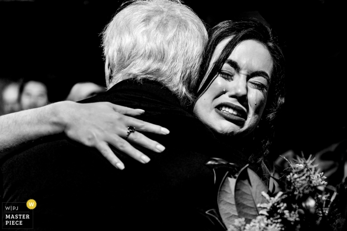Photo by: <a href="https://www.wpja.com/contests/2019-v01/best-wedding-photographers/2429711">Laura Robinson - Delano Minnesota</a> Nicollet Island Pavilion wedding photograph - Bride Sobs While Dad Gives Her Away
