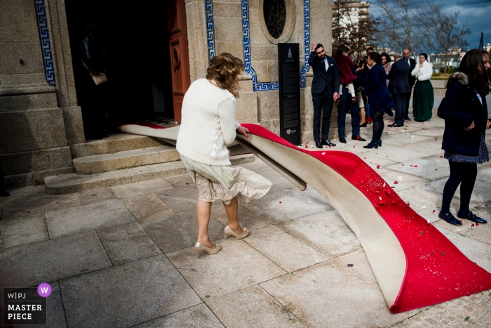 Photo by: <a href="https://www.wpja.com/contests/2019-v01/best-wedding-photographers/2431636">Luis Efigénio - Porto </a> Trofa, Portugal Church wedding - Windy Wedding day with the red carpet blowing away