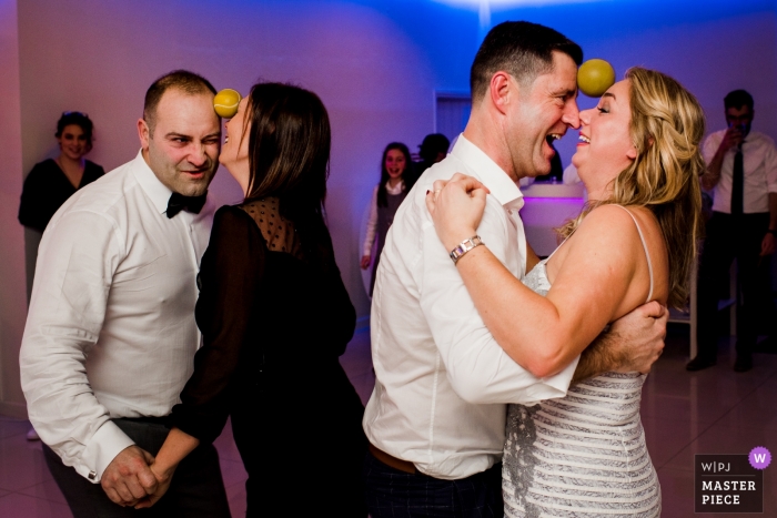 Photo by: <a href="https://www.wpja.com/contests/2019-v01/best-wedding-photographers/2431651">Luis Efigénio - Porto </a> Santo Tirso, Portugal - Game during Wedding Party. The couples needed to dance without the ball fall of.