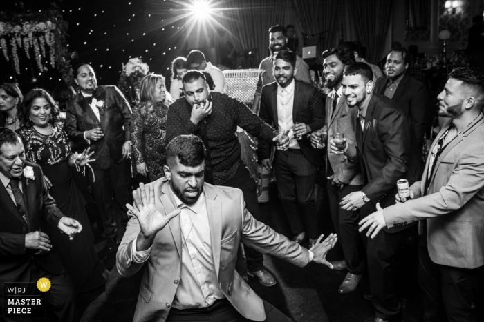 Photo by: <a href="https://www.wpja.com/contests/2019-v01/best-wedding-photographers/2432521">Thomas Campean - Toronto Ontario</a> The groom on the dance floor surrounded by his friends at his wedding in Toronto, Canada.