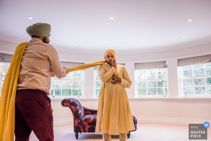 Photo by: <a href="https://www.wpja.com/contests/2019-v01/best-wedding-photographers/2434121">Jay Hoque - Uxbridge London</a> A groom gets prepared for the ceremony - Newbury Racecourse, UK