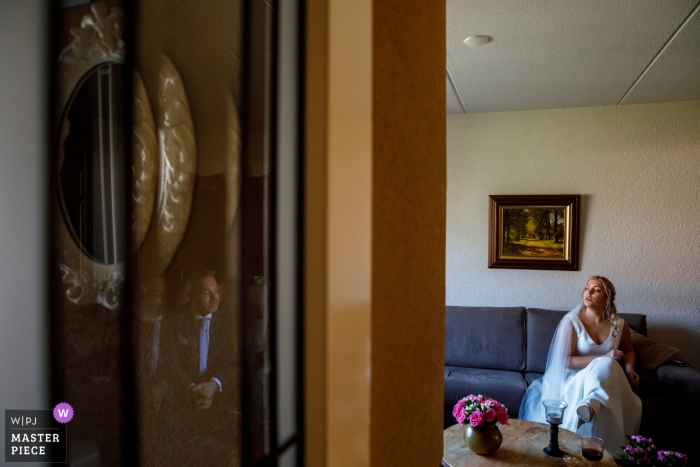 Photo by: <a href="https://www.wpja.com/contests/2019-v01/best-wedding-photographers/2435896">Indra Simons - Enschede Overijssel</a> Wedding photograph from Enschede NL - the bride sits while waiting for the groom