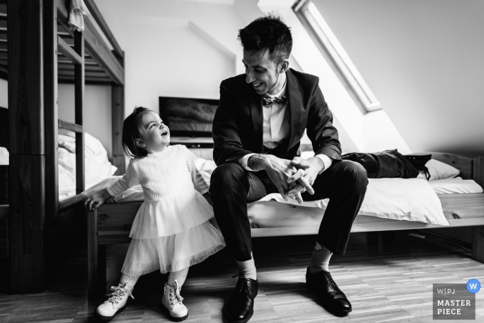 Photo by: <a href="https://www.wpja.com/contests/2019-v01/best-wedding-photographers/2436611">Krisztian Bozso - Budapest Budapest</a> Gyongyossolymos, Hungary wedding - the Groom and his daughter hours before the wedding