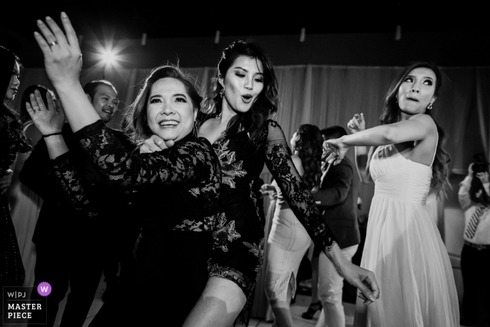 Photo by: <a href="https://www.wpja.com/contests/2019-v01/best-wedding-photographers/2437001">Chris Shum - Sunnyvale California</a> Community Center, Palo Alto Reception dancing for these wedding party women