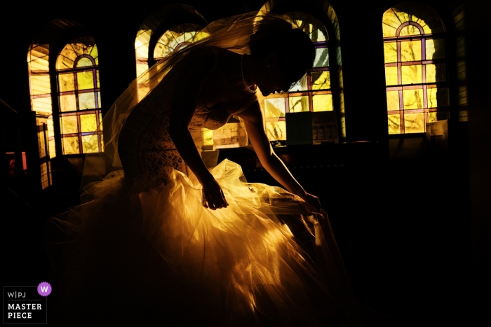 Photo by: <a href="https://www.wpja.com/contests/2019-v02/best-wedding-photographers/2443266">Wenjie Han - Long Island City New York</a> Fairmont Copley Plaza, Boston reception - the bride is preparing for ceremony entrance at Goddard Chapel, Medford