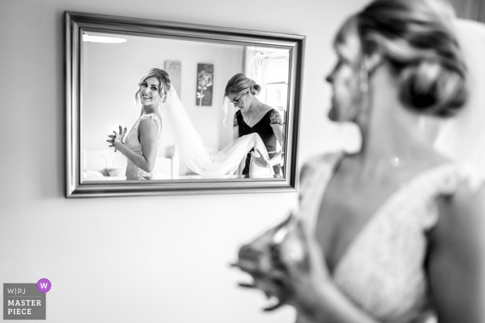 Photo by: <a href="https://www.wpja.com/contests/2019-v02/best-wedding-photographers/2444641">Rich Calver - Lisburn County Antrim</a> Carlingford, Ireland wedding photography - Bride seeing herself in the mirror for first time as she is about to leave for ceremony