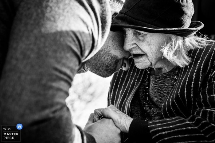 Photo by: <a href="https://www.wpja.com/contests/2019-v03/best-wedding-photographers/2452366">Tom Beynon - Cambridge Cambridgeshire</a> The School House, Weeford, Birmingham, UK wedding photographer | The groom has a tender moment with his grandmother.
