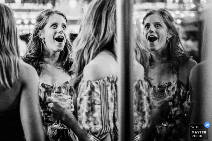 wedding photography showing Guests caught in an expressive moment during the Reception event Cupitts Winery Ulladulla wedding photographer | Guests are caught in an expressive moment during a Wedding Reception Photo