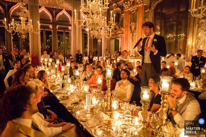 Photo by: <a href="https://www.wpja.com/contests/2019-v04/best-wedding-photographers/2463826">Daniele Borghello - Padova</a> Pisani Moretta Palace - Venice Wedding Reception Photography | The witness of the bride makes a speech in front of a hundredth of guests in a fairy tale atmosphere.