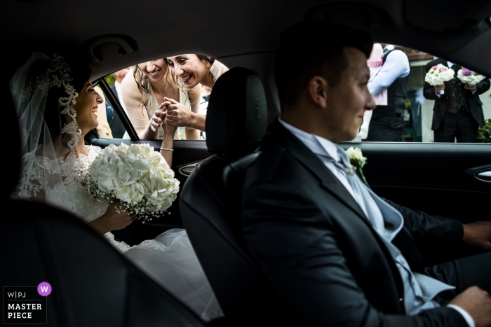 Photo by: <a href="https://www.wpja.com/contests/2019-v04/best-wedding-photographers/2465176">Pasquale Minniti - Reggio Calabria</a> Riace in Reggio Calabria photo of the bride greeting her friends before the church ceremony