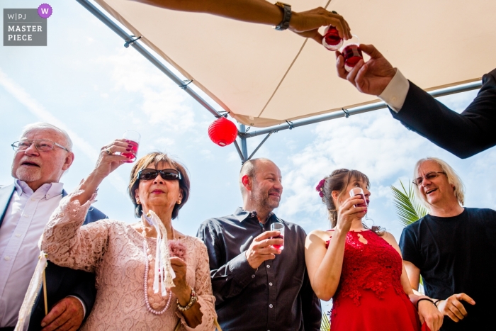 Photo by: <a href="https://www.wpja.com/contests/2019-v04/best-wedding-photographers/2466256">Steven Herrschaft - Lützelbach Hessen</a> Strandperle Geisenheim Wedding Photography of Drinking Moment with Cheers and a Toast.