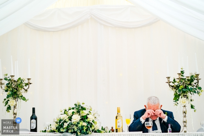 Photo by: <a href="https://www.wpja.com/contests/2019-v04/best-wedding-photographers/2467411">Andrew Billington - Leek Staffordshire</a> The grandfather of the bride takes a moment by himself during the wedding reception at a Southampton, UK wedding