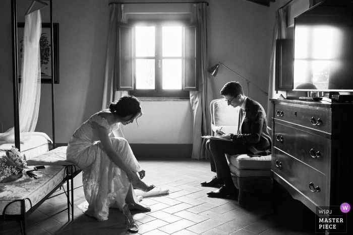 Villa Medicea di Lilliano, Wine Estate photography of bride getting ready while groom puts finishing touches on his speech 