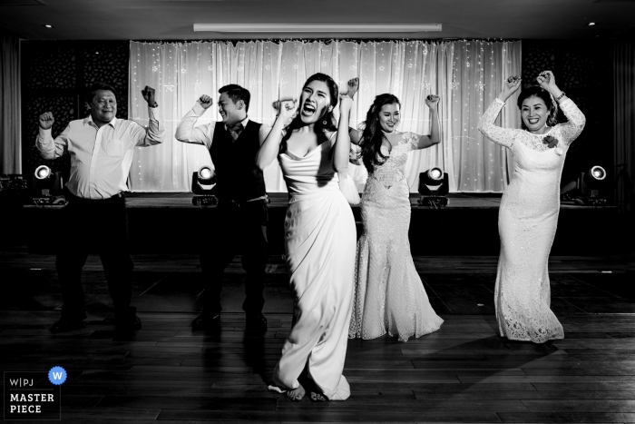 Photo by: <a href="https://www.wpja.com/contests/2019-v04/best-wedding-photographers/2468436">Tuan Duong - Ho Chi Minh </a> Wedding photo of bridal party on the dance floor at the Amiana Resort in Nha Trang