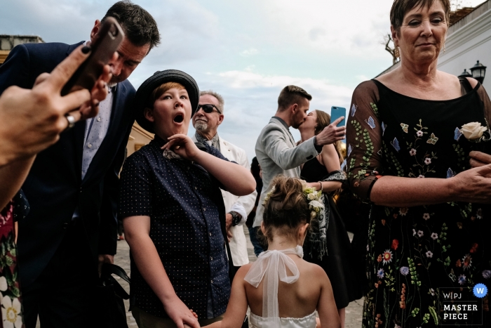 Photo by: <a href="https://www.wpja.com/contests/2019-v04/best-wedding-photographers/2468841">Roque Reyes - Oaxaca de Juarez Oaxaca</a> Casa Oaxaca, Oaxaca City, Oaxaca, Mexico photo of wedding guests on the streets