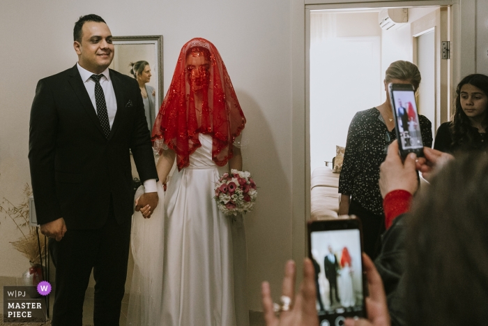 Photo by: <a href="https://www.wpja.com/contests/2019-v04/best-wedding-photographers/2469146">Emre Nesli - İstanbul Istanbul</a> Adana Divan Hotel wedding photographer shot of the groom's family saying goodbye to the couple while they are leaving home to the wedding