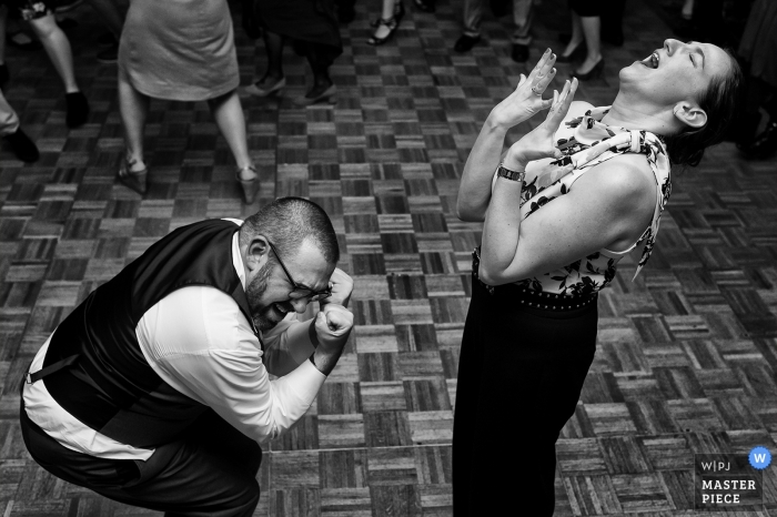 Photo by: <a href="https://www.wpja.com/contests/2019-v05/best-wedding-photographers/2473931">Tara Theilen - Carson City Nevada</a> Granlibakken, Tahoe City, CA Wedding Photographer - Image of the groom and his sister getting down on the dance floor.