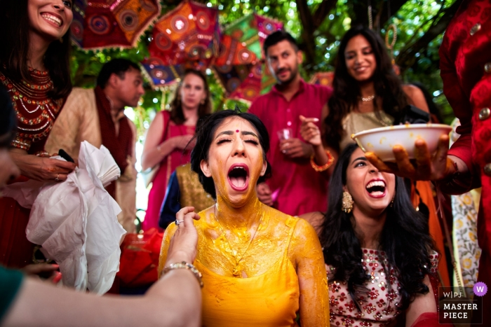 Photo by: <a href="https://www.wpja.com/contests/2019-v05/best-wedding-photographers/2476231">Damiano Salvadori - Certaldo Firenze</a> Il Ciocco Resort - Barga Tuscany - Wedding image of the bride doing the vidhi ceremony (with the yellow paste)