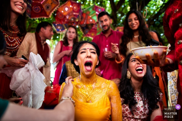 Il Ciocco Resort - Barga Tuscany - Wedding image of the bride doing the vidhi ceremony (with the yellow paste) 