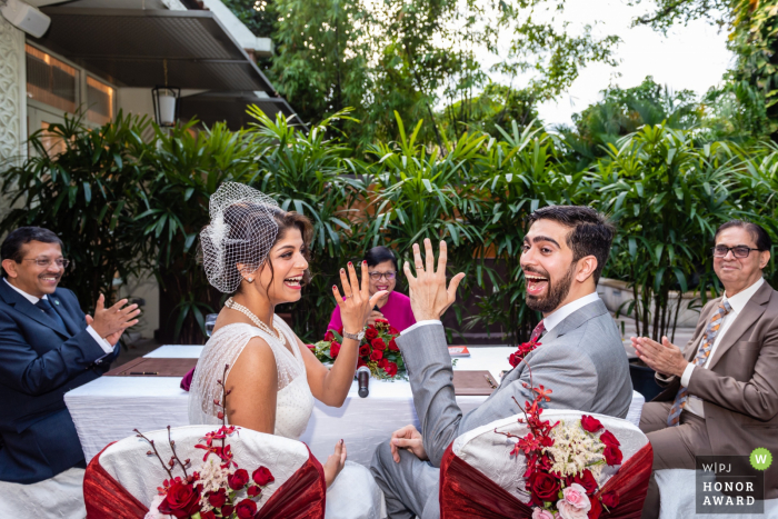 Shangri-La Hotel Singapore wedding event venue photography | Couple showing off their rings happily 