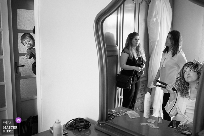 Photo by: <a href="https://www.wpja.com/contests/2019-v05/best-wedding-photographers/2478446">Andrea Bagnasco - Varazze Savona</a> Varazze, Italy - Wedding photo of the bride getting hear hair done during getting ready