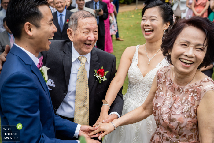 Atlanta Botanical Gardens wedding venue photography in Georgia | Laughing during the outdoor ceremony 