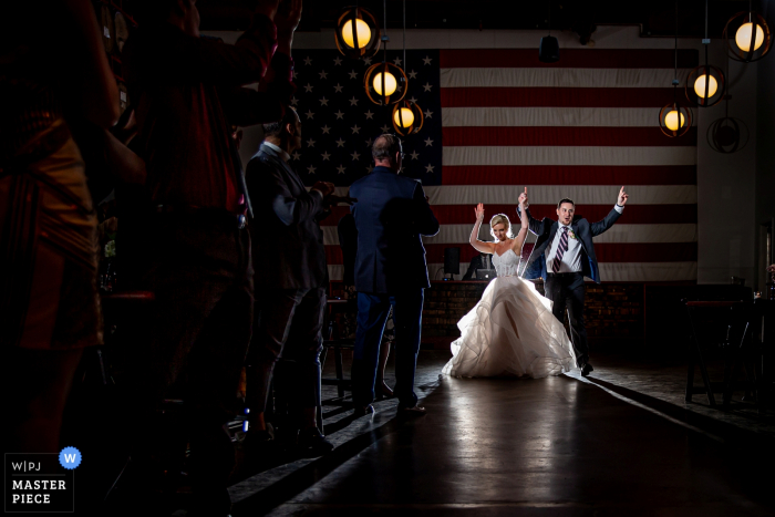 Photo by: <a href="https://www.wpja.com/contests/2019-v05/best-wedding-photographers/2478891">Victoria Sprung - Chicago Illinois</a> Chicago - Revolution Brewing Wedding Venue Photos - Award winning image of the couple's introduction