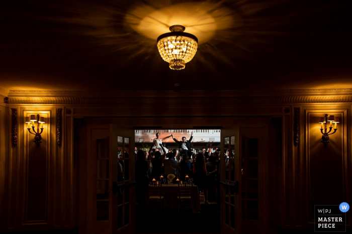 Photo by: <a href="https://www.wpja.com/contests/2019-v05/best-wedding-photographers/2478901">Victoria Sprung - Chicago Illinois</a> Blackstone Hotel - Chicago Wedding Reception Photographer - Image of the hora for the bride and groom