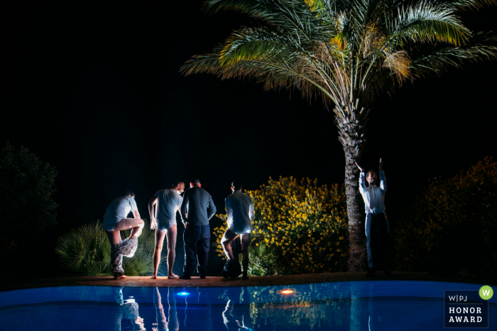 outdoor, night wedding venue photography at the pool with the Groom and friends Villa Mbastita wedding venue photography at the pool with the Groom and friends