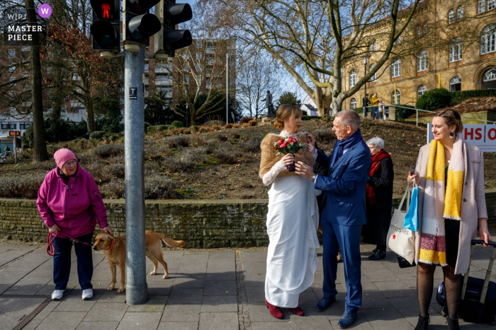 Photo by: <a href="https://www.wpja.com/contests/2019-v05/best-wedding-photographers/2481241">Indra Simons - Enschede Overijssel</a> Osnabruck, NL wedding photographer | Picture of the Bridal party crossing the street on their way to the groom