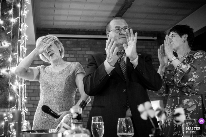 Image showing the Mother of the bride relief after completing her speech Victoria Warehouse Manchester Photographer | Image showing the Mother of the bride relief after completing her speech