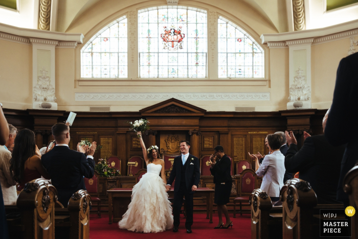 Photo by: <a href="https://www.wpja.com/contests/2019-v05/best-wedding-photographers/2482171">Lyndsey Goddard - London London</a> Islington Town Hall Wedding Pictures - The jubilant bride at the end of ceremony