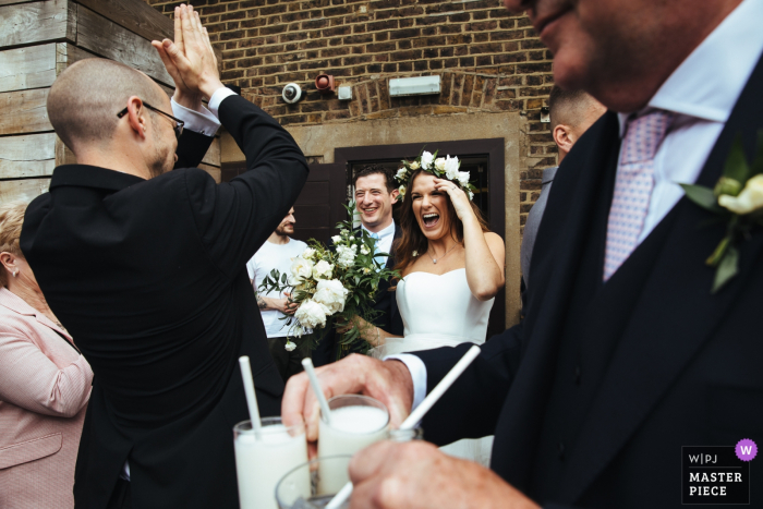 Photo by: <a href="https://www.wpja.com/contests/2019-v05/best-wedding-photographers/2482181">Lyndsey Goddard - London London</a> Vivo Islington wedding day photography showing the bride and groom arrive at reception