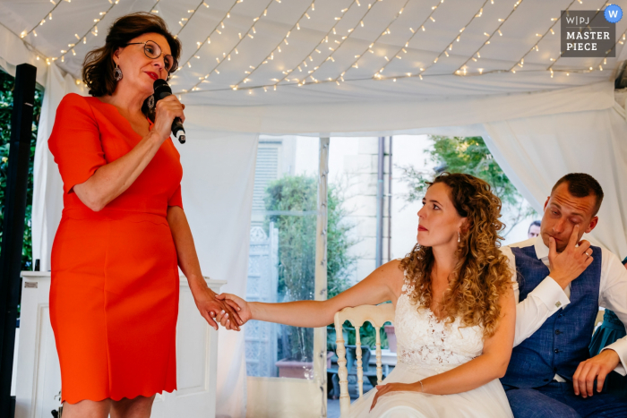 Lake Como - villa geno wedding photograph showing the mother of the brides speech with groom wiping a tear 