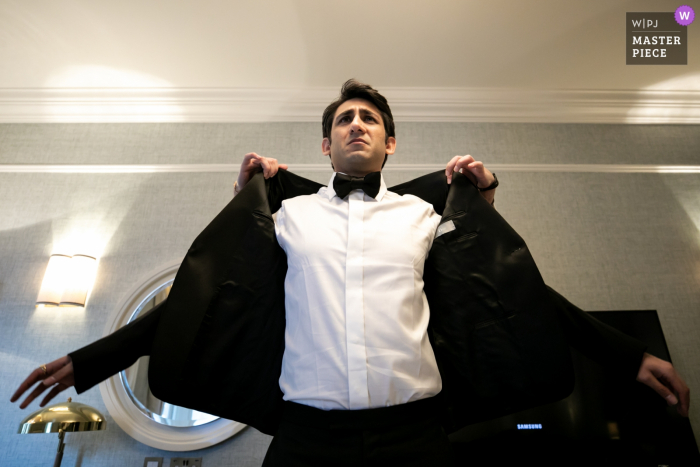 Photo by: <a href="https://www.wpja.com/contests/2019-v06/best-wedding-photographers/2487336">Chaiyasith Junjuerdee - Fulham London</a> Hotel The Savoy, London getting ready photo showing the Groom Suit Up