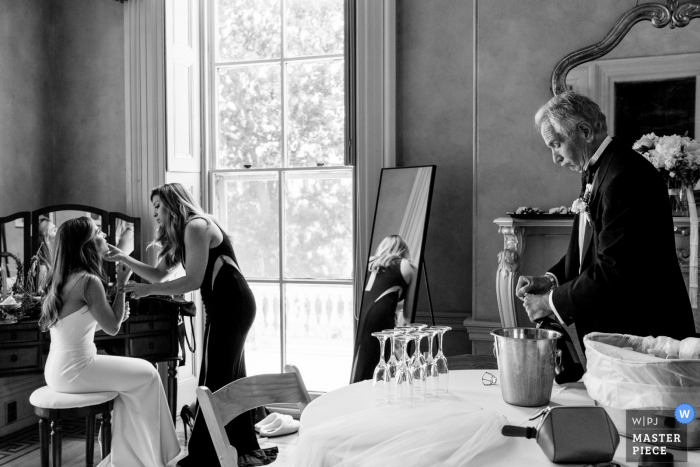 Photo by: <a href="https://www.wpja.com/contests/2019-v06/best-wedding-photographers/2492991">JD Land - Marlton New Jersey</a> Black and White Wedding Photography at Glen Foerd - The Bride and her MOH putting on the final touches while her father is ready to get the party going.