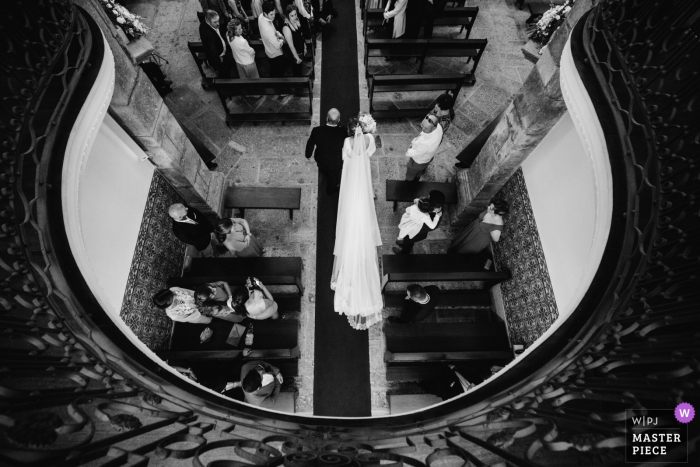 Photo by: <a href="https://www.wpja.com/contests/2019-v06/best-wedding-photographers/2493541">Daniel Monteiro - Porto </a> The bride and her father walk down the aisle to the altar in Quinta dos Pinheirais in this photo taken from above by a Portugal wedding photographer.