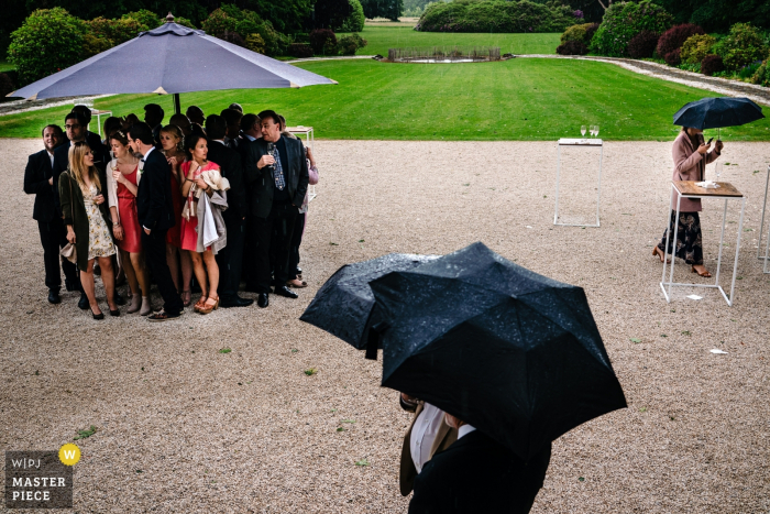 Photo by: <a href="https://www.wpja.com/contests/2019-v06/best-wedding-photographers/2493601">Yves Schepers - Bonheiden Antwerpen</a> Surprise rainfall in this Kasteel Ter Block wedding reception photo