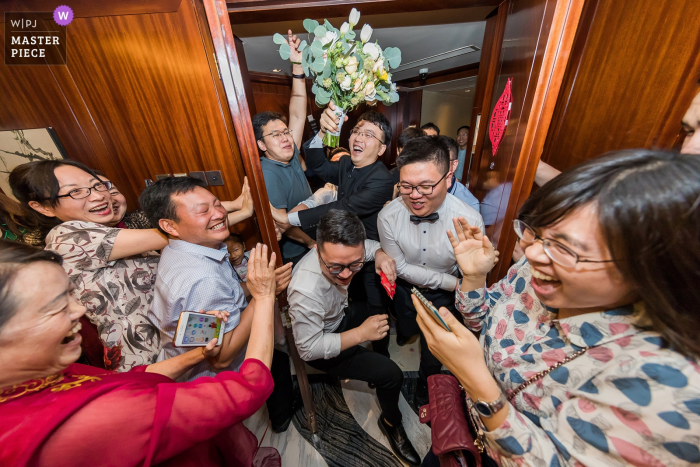 Photo by: <a href="https://www.wpja.com/contests/2019-v06/best-wedding-photographers/2494046">Nan Zhao - Beijing City </a> Guests and groomsmen are surprised in this documentary-style wedding photo by an award-winning Beijing, China photographer.