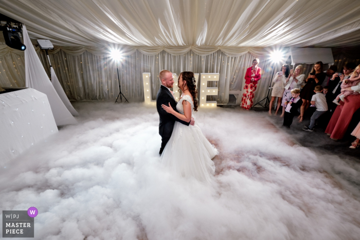 Photo by: <a href="https://www.wpja.com/contests/2019-v06/best-wedding-photographers/2494716">Clive Blair - Birmingham West Midlands</a> Wedding Photography from Bordesley Park - Bride and groom dancing on the clouds during their first dance