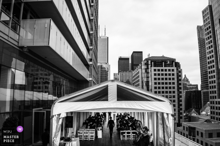 Photo by: <a href="https://www.wpja.com/contests/2019-v06/best-wedding-photographers/2494996">Cafa Liu - Richmond Hill Ontario</a> TIFF TORONTO WEDDING PHOTO - the groom wakling into the ceremony location