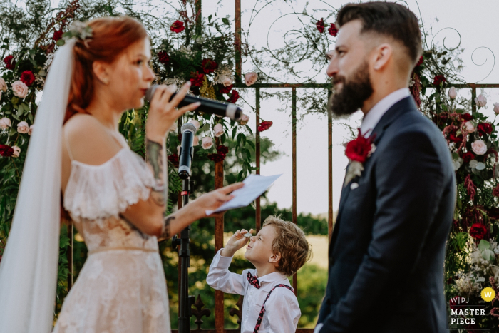 Photo by: <a href="https://www.wpja.com/contests/2019-v06/best-wedding-photographers/2495436">Renan Radici - Porto Alegre Rio Grande do Sul</a> The bride reads her vows to the groom at Vinicola Laurentia in this award-winning wedding photo taken by a Rio Grande do Sul, Brazil photographer